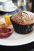 A bran muffin with jam