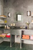 Elevation of concrete washstand with towel shelves below mirror and sconce lamps on concrete wall