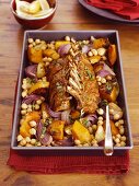 Spicy saddle of lamb with roast pumpkin and chickpeas in the roasting tin