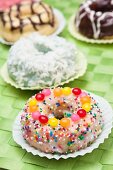 Frosted Doughnut with Sprinkles and Candies; Assorted Doughnuts