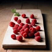 Raspberries on a wooden board