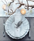 A Christmas place setting with an orchid