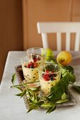 Three glasses of zabaglione with blackcurrants and redcurrants