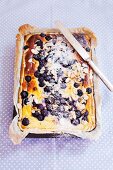 Blueberry cake with slivered almonds and icing sugar
