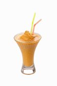 An apricot shake with straws