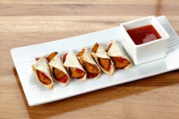 Mini wraps with barbecue sauce