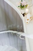 Flowers, candle and animal skull decorating stairwell