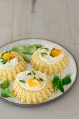 Millet cake with fried quail's eggs