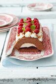 Chocolate Swiss roll with raspberry jam and cream