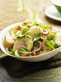 Potato salad with red onions and herbs