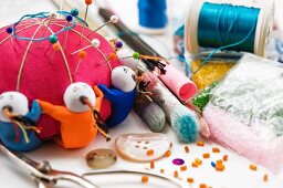 Pin cushions, scissors, buttons and craft supplies