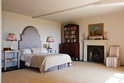 Bedroom in home of fabric designer Richard Smith in East Sussex with 18th century Capriccio