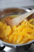 Orange fillets being caramelised