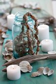 A jar with a string of shells and candles