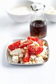 Tomatoes with tofu, soy beans and sesame seeds