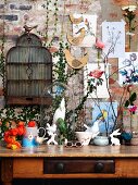 Spring atmosphere - bird and rabbit motifs on vintage console table and on brick wall