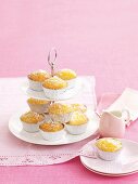 Coconut and lemon cupcakes on a cake stand