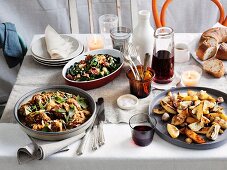 An Easter meal of lamb, sautéed green vegetables and potato wedges