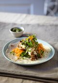 Tortilla topped with lentils, carrots, shiitake mushroom and oranges