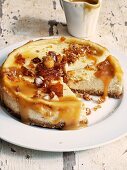 Cheesecake with salted caramel sauce and macadamia nuts