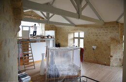 Refuge in Chateau Maignaut with wooden-beamed ceiling and ancient sandstone walls