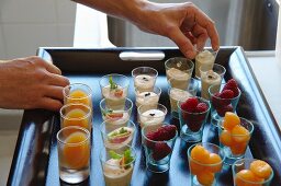 Mini dessert glasses on a tray in French restaurant La Table des Cordeliers run by Michelin starred chef Eric Sampietro