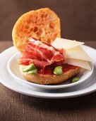 Raw ham and cheese on bruschetta