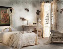Romantic bedroom with lacy bedspread & curtains
