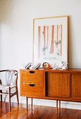 Retro-look sideboard with large drawers and sliding doors on white wall