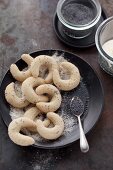 Vanillekipferl (cresent-shaped vanilla biscuits) with poppy seeds