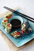Cucumber rolls made with rice paper or nori, with a soy dip