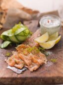 Filleted char with dill flowers, remoulade, cucumber slices and lemon wedges