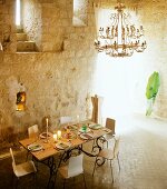Set dining table in tower interior in Chateau Maignaut (Pyrenees, France)