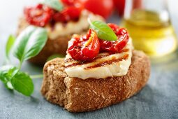 Crostini topped with grilled goat's cheese and dried tomatoes