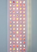 Modern, flat light sculpture with dots of light