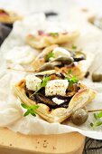 Raclette with aubergines, feta and giant capers