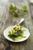 Pesto on a plate with a spoon