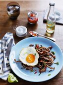 Pigs ears with chilli, lime and fried egg (USA)