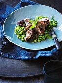 Roast shoulder of lamb with peas and mint