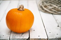 A pumpkin on a wooden table