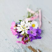 Posy of garden flowers on vintage shelf