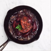 Duck and Poached Quince in a Cast Iron Skillet with Caramelized Onions