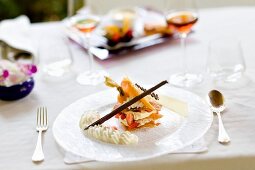 Pastry interleaved with white chocolate cream, strawberries and physalis