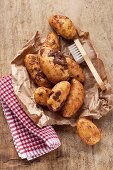 New potatoes on brown paper with a brush