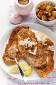 Wiener Schnitzel (breaded veal escalope from Vienna) with horseradish and roast potatoes