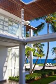 Roofed area in well-tended outdoor area of exclusive Caribbean lodge