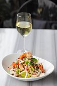 Seafood salad with a glass of white wine