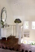 White-painted chest of drawers on top landing in Scandinavian house