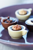 Filled chocolates in the shape of coffee cups