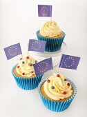 Three cupcakes decorated with buttercream and EU flags